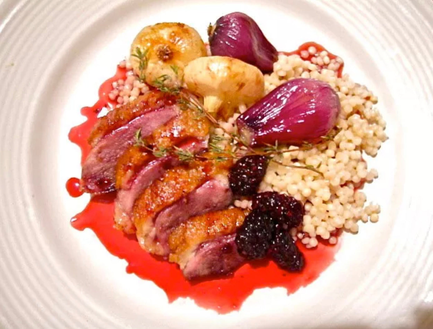 Crispy Duck with Blackberry Gastrique, Roasted Pearl Onions, and Israeli Cous-Cous Recipe